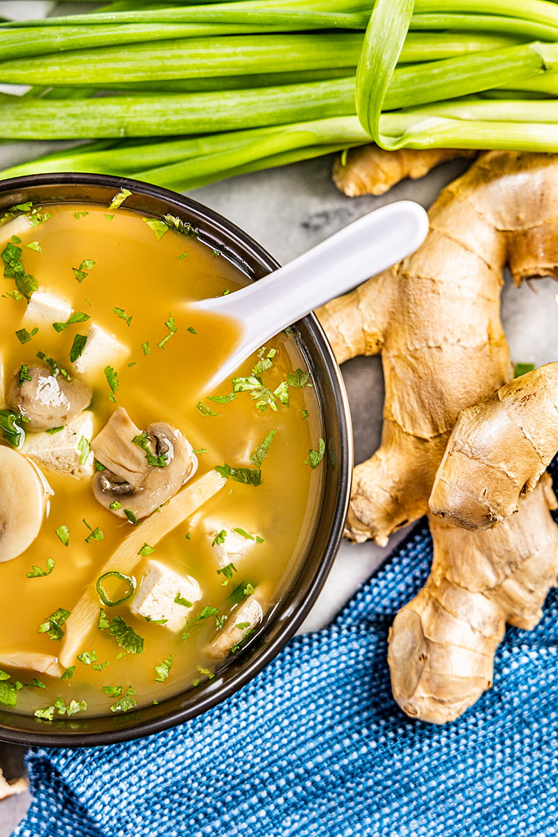 Close up view of a bowl of hot and sour soup.