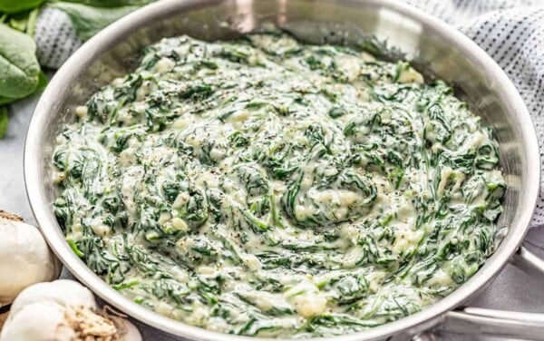 Creamed spinach in a stainless steel skillet