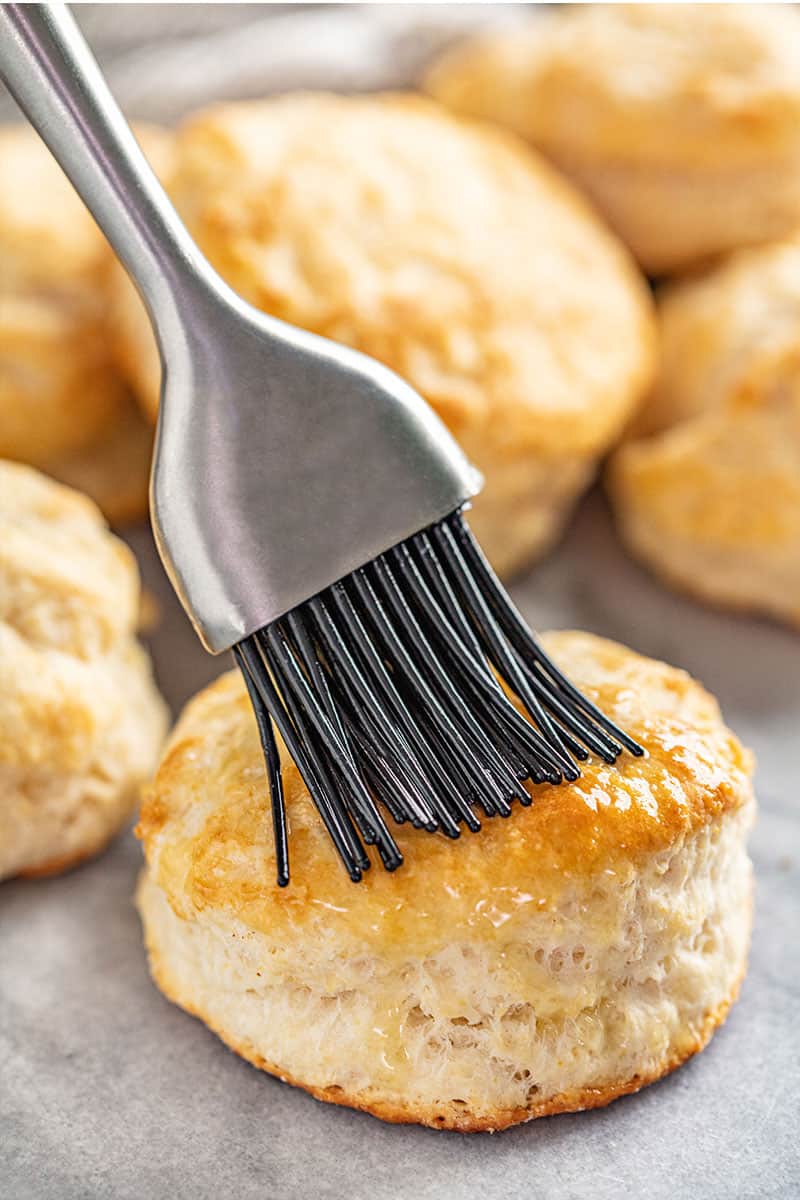 Butter brushed onto a freshly baked biscuit