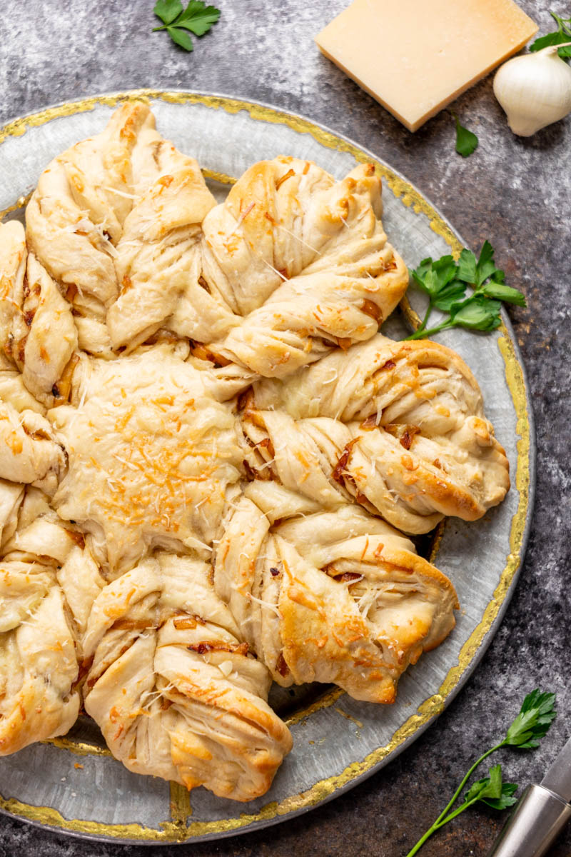 Close up overhead view of a loaf of Gruyere Onion Star bread.