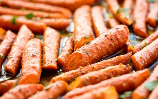 Honey roasted carrots on a baking sheet.