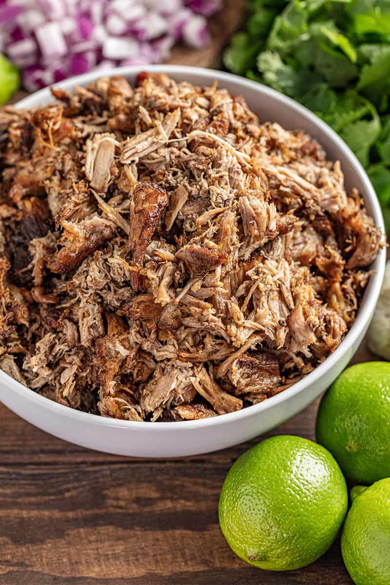 Crockpot carnitas in a white bowl