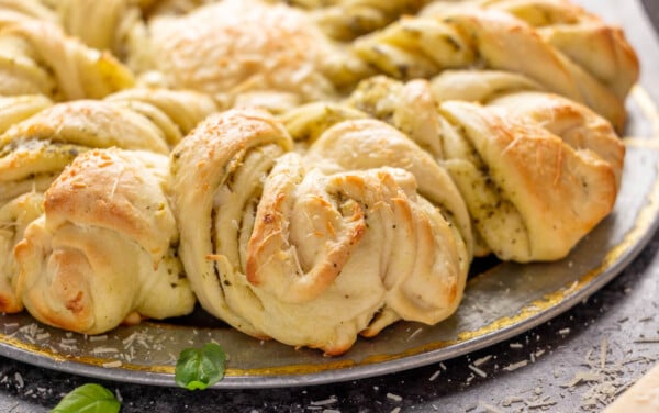 Close up image of the sides of a loaf of pesto parmesan star bread.