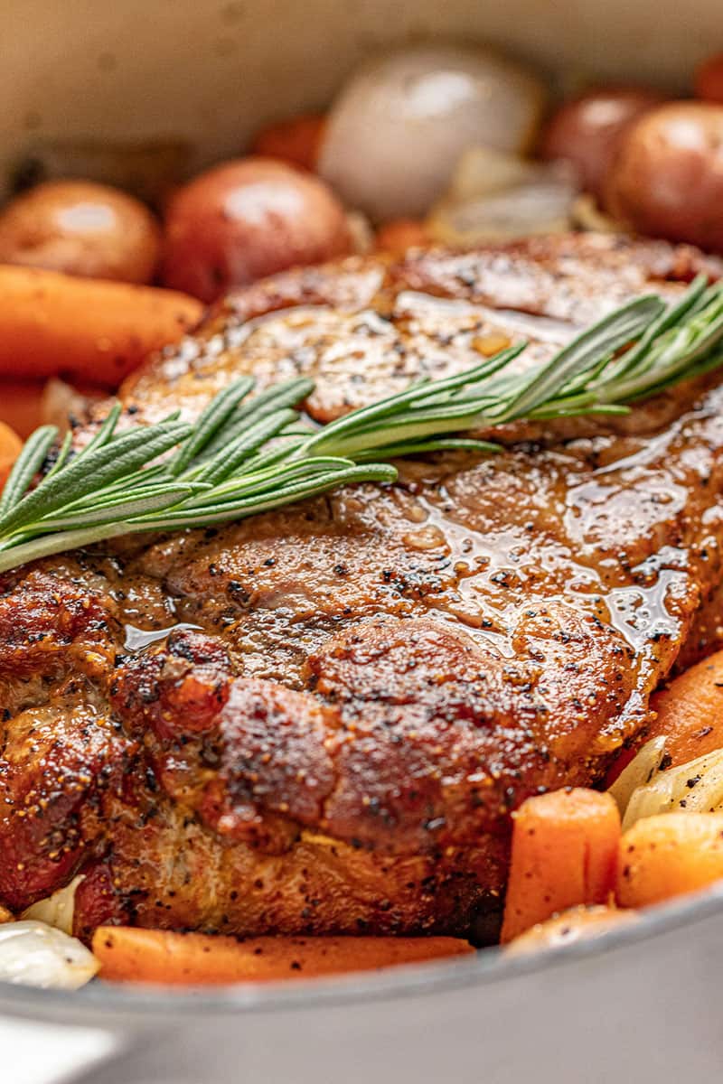 Close up view of pork Roast with rosemary sprig on top