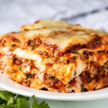 The Most Amazing Lasagna Recipe is the absolute perfect recipe for homemade Italian-style lasagna. The balance between layers of cheese, noodles, and homemade bolognese sauce is perfection!