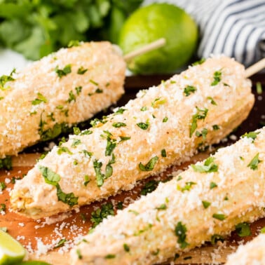 Authentic Mexican Street Corn rolled in a creamy mayonnaise/crema mixture and topped with cotija cheese and cilantro