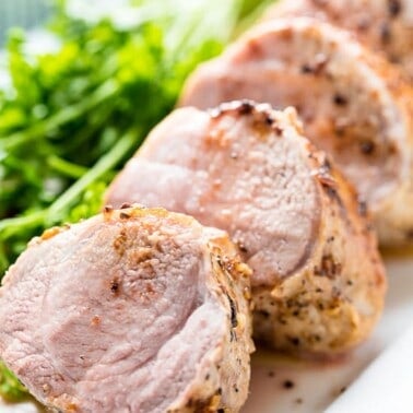 Garlic Butter Pork Tenderloin served in slices on a serving platter