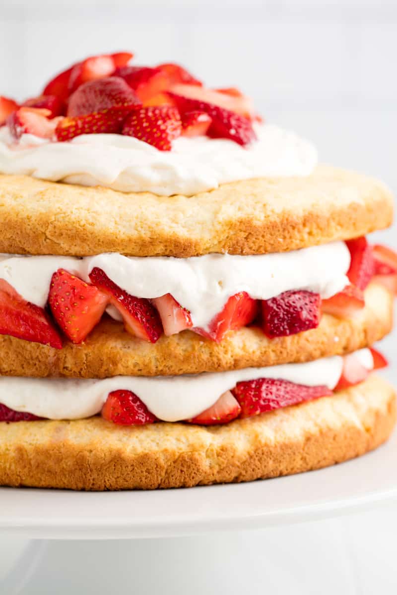 Strawberry Shortcake on a white cake stand.