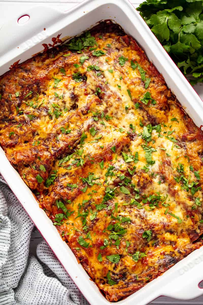 Beef Enchiladas in a ceramic baking dish.