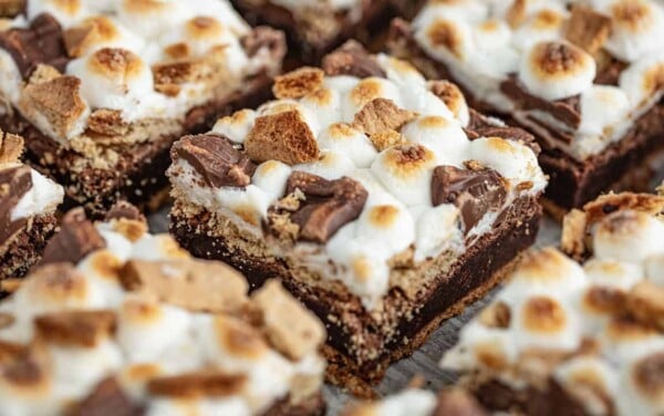 Angled close up view of S'mores Brownies cut into squares.