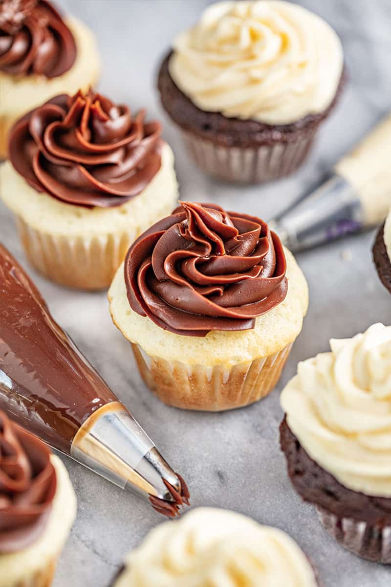 Chocolate Sweetened Condensed Milk Frosting on a white cupcake.