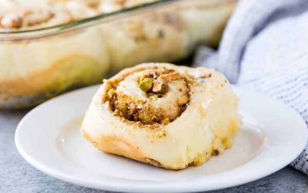 Baklava cinnamon roll on a white plate.