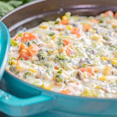 A large pot filled with vegetable soup.