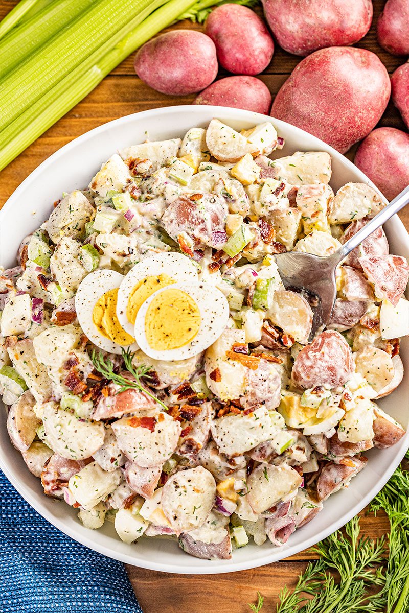 Overhead view of a bowl of creamy potato salad.