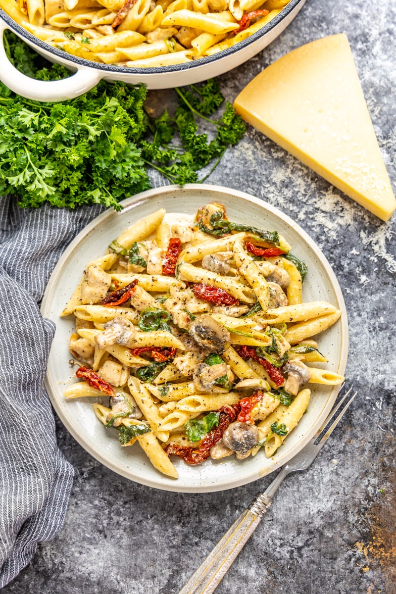 Overhead v view of a serving of Italian chicken and pasta.