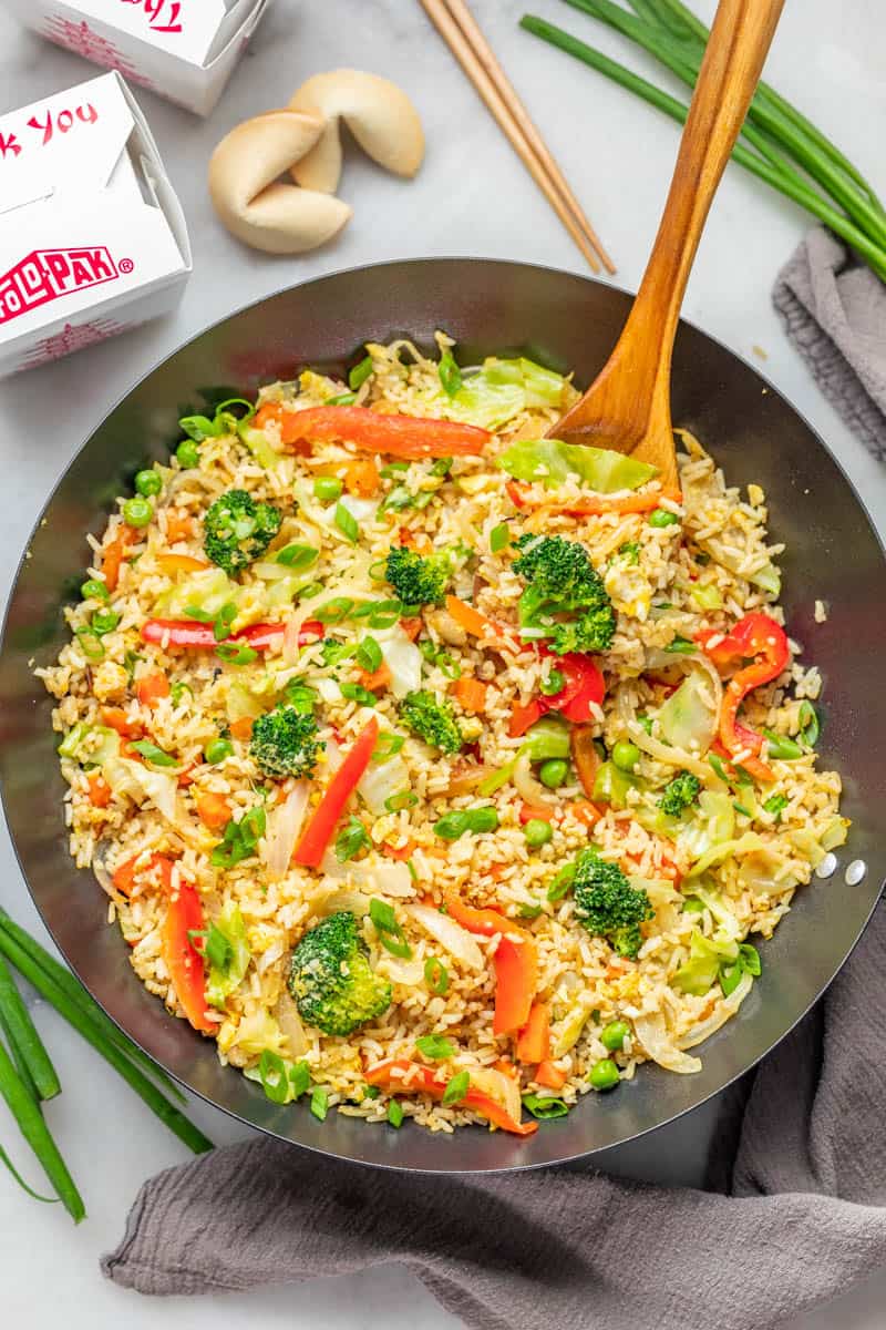 Overhead view of takeout vegetable fried rice in a wok.